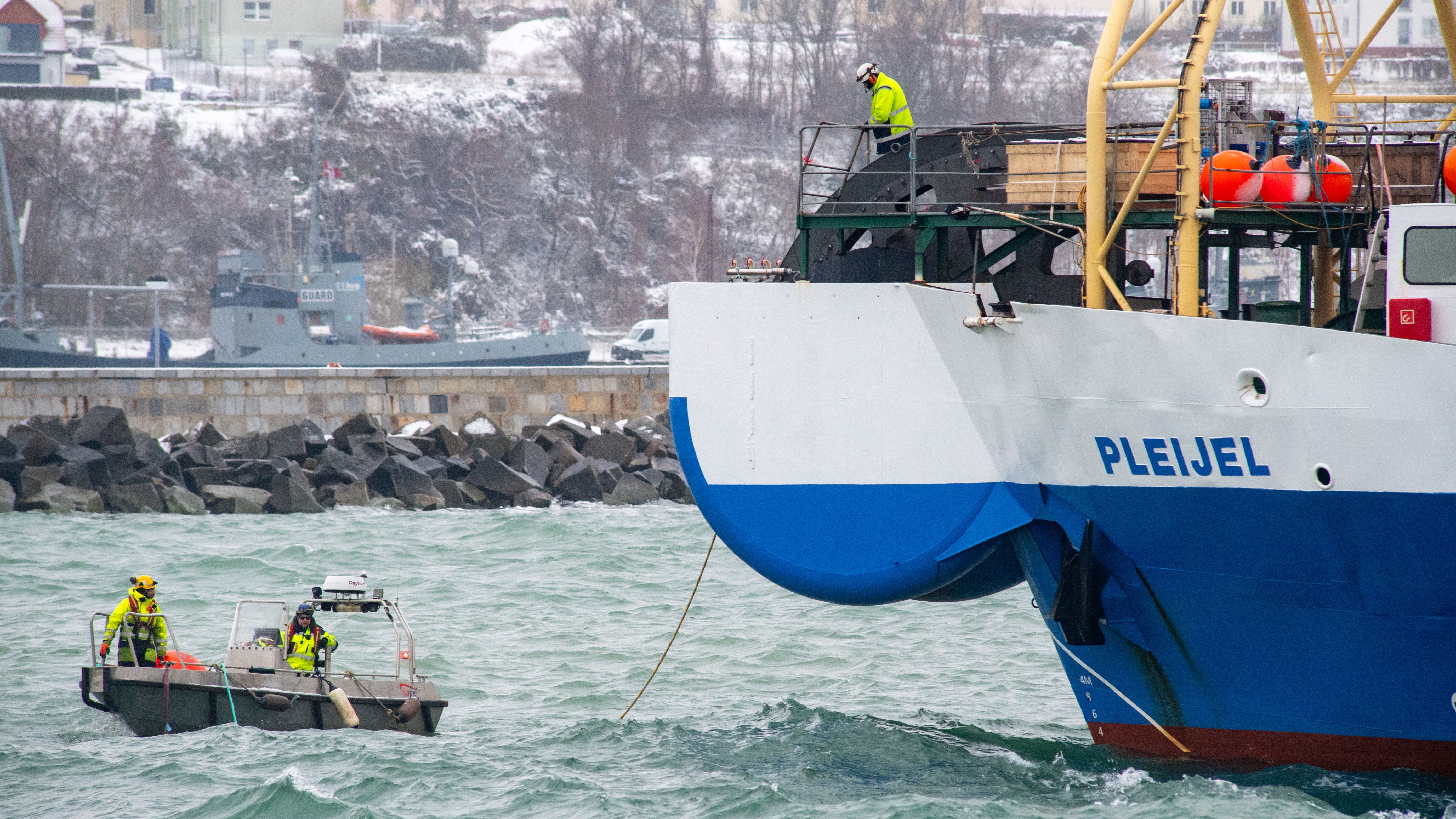 A fiber optic cable is pulled ashore from the cable-laying ship "Pleijel" in November, 2023. Photo /  Stefan Sauer/picture alliance via Getty Images