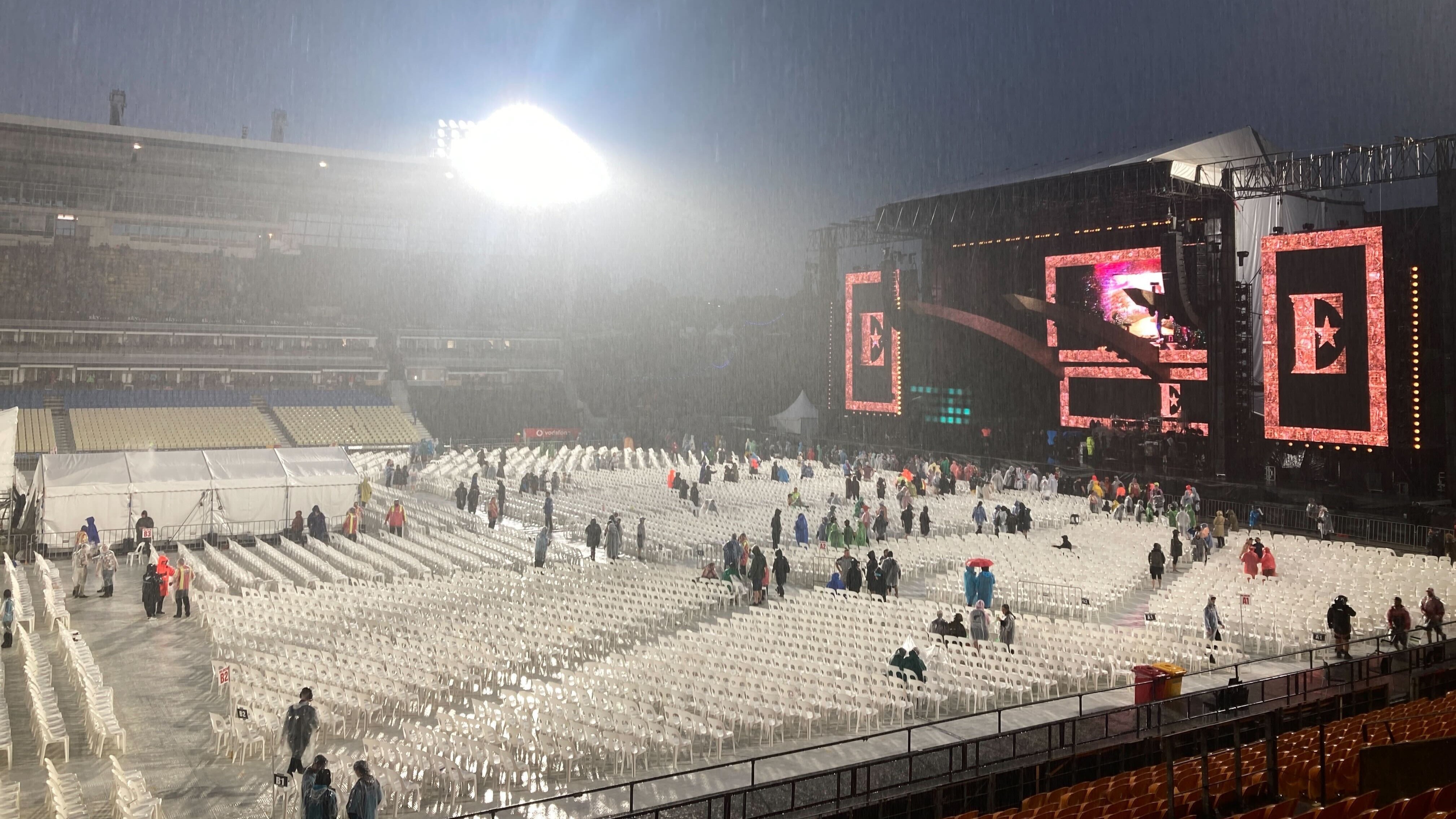 Elton John concertgoers evacuate Mt Smart Stadium after announcements the concert was cancelled following heavy rain. Photo / Nick Bewley