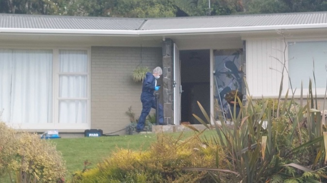 Police investigate a Russell Cres address in Rotorua where two people suffered critical injuries in an assault believed to be connected to a woman's death at a separate address. Photo / Ben Fraser