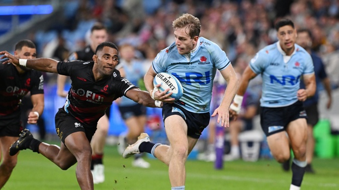 Sevu Reece chases down Max Jorgensen of the Waratahs. Photo / Photosport