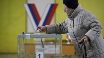 Putin is poised to extend his rule in highly orchestrated vote even as Russians quietly protest