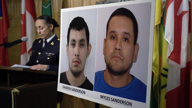 Assistant Commissioner Rhonda Blackmore speaks next to images of Damien Sanderson and Myles Sanderson during a press conference at the Royal Canadian Mounted Police "F" Division headquarters in Regina, Saskatchewan, on Sunday, Sept. 4, 2022. (Photo / AP)