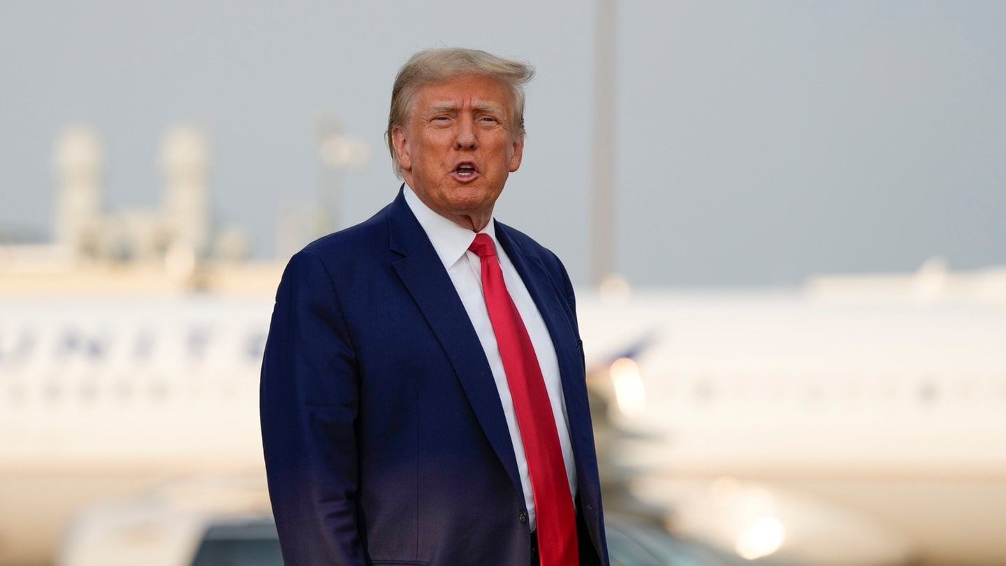 Former President Donald Trump steps off his plane as he arrives at Hartsfield-Jackson Atlanta International Airport in Atlanta. Photo / AP