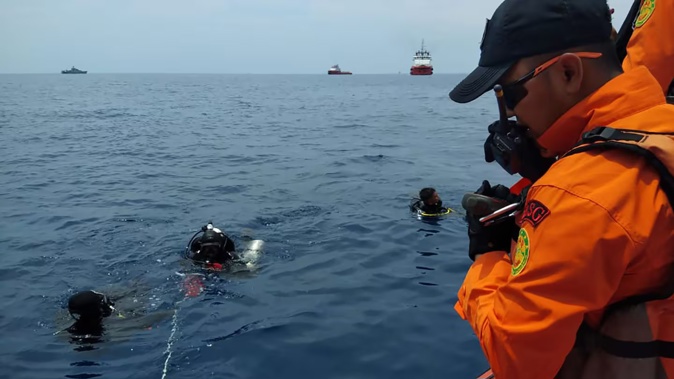 Divers search for survivors of the Boeing 737 MAX aircraft operated by Lion Air which crashed into the Java Sea. Photo / Supplied