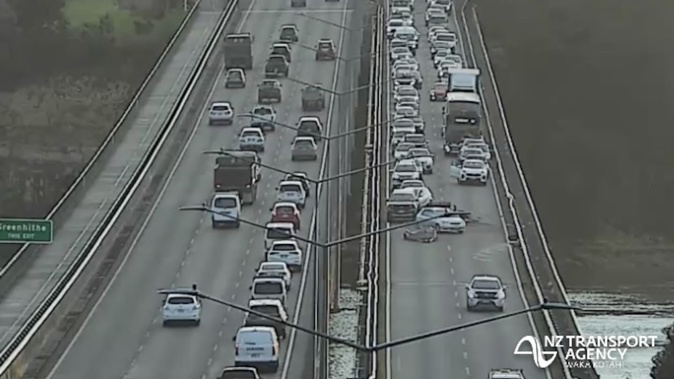 A crash on Auckland's Upper Harbour Bridge has blocked two westbound lanes, causing morning commuter chaos. Photo / NZ Transport Agency
