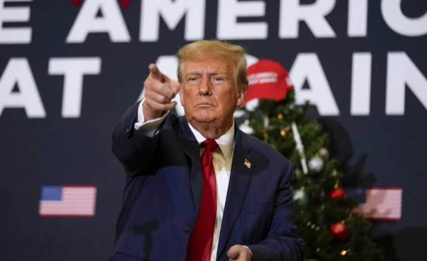 Former President Donald Trump points to supporters during a rally in Iowa. Photo / AP