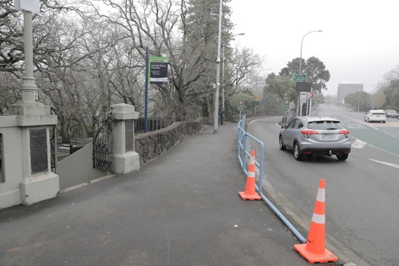 Four fleeing offenders crashed their getaway vehicle into the gatepost of Symonds St Cemetery this morning. Photo / Michael Craig