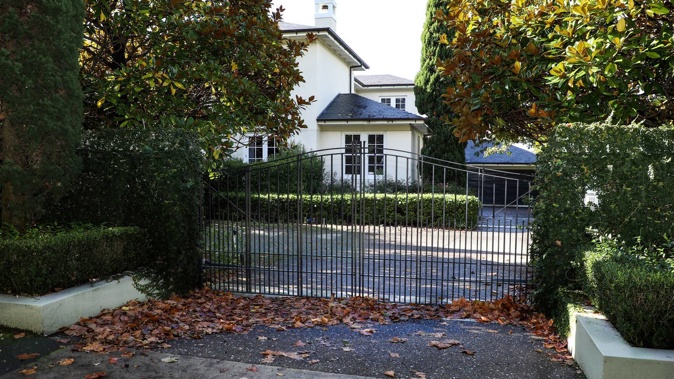 Neighbours are now concerned about the appearance of the home with grime building on its walls and its garden being unkempt. Photo / Hayden Woodward