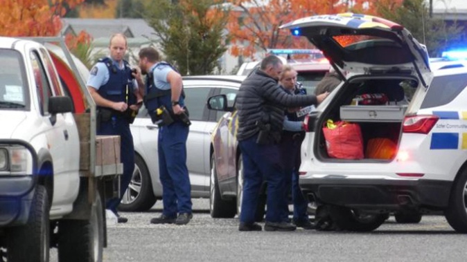 Police officers arrest Tweedy in Cromwell. (Photo / Jared Morgan)