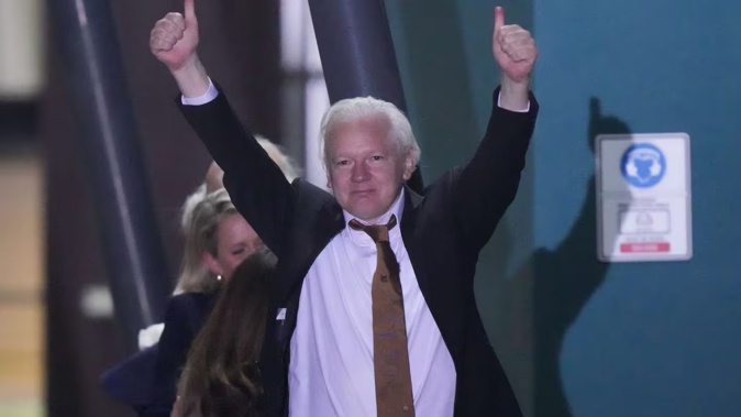 WikiLeaks founder Julian Assange gestures after landing at RAAF air base Fairbairn in Canberra, Australia, Wednesday, June 26 2024. Photo / AP