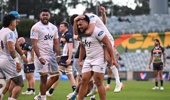 Moana Pasifika players celebrate after winning their Super Rugby Pacific Round 16 match. Photo / Photosport