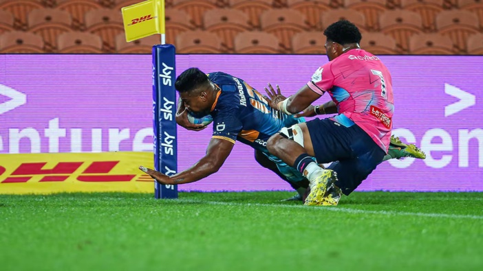 Julian Savea of Moana Pasifika scores a try in front of empty seats in Hamilton. Photosport