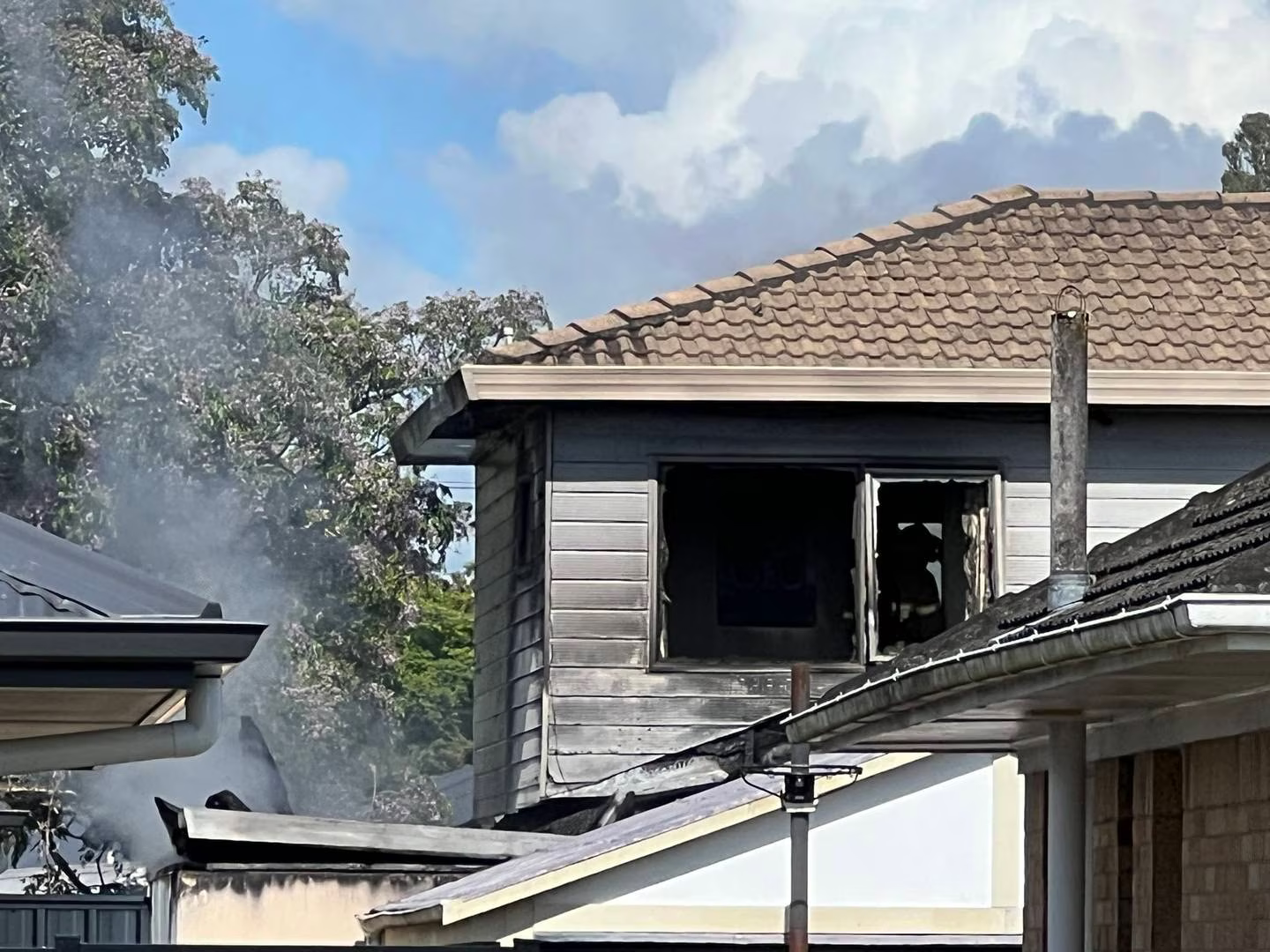 Windows shattered from a house fire in Hillcrest, Hamilton. Photo / Malisha Kumar
