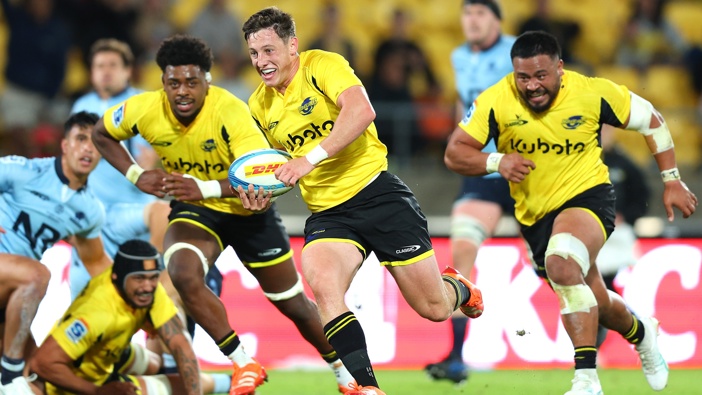 Cam Roigard of the Hurricanes runs in for a try during the round seven Super Rugby Pacific match between Hurricanes and NSW Waratahs at Sky Stadium, on March 28, 2025, in Wellington, New Zealand. (Photo by Hagen Hopkins/Getty Images)