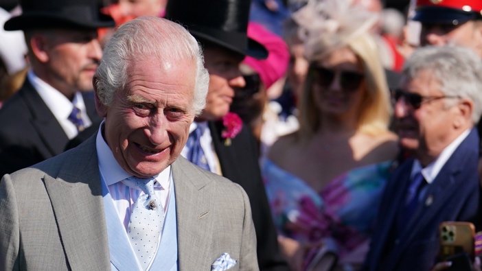 King Charles III speaks to guests attending a Royal Garden Party at Buckingham Palace on May 8, 2024 in London, England. Photo by Jordan Pettitt - Pool/Getty Images