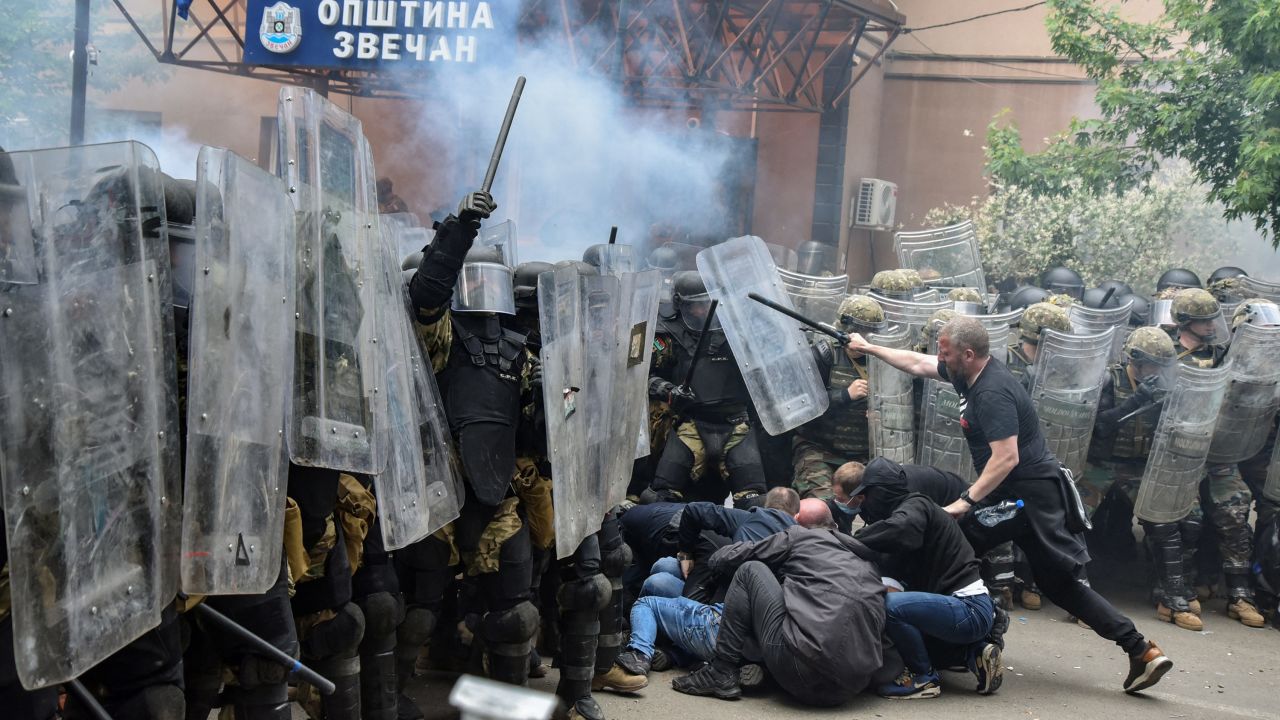 NATO's peacekeeping Kosovo Force (KFOR) clash with local protesters at the entrance of the municipality office, in the town of Zvecan, Kosovo, on May 29. Laura Hasani/Reuters