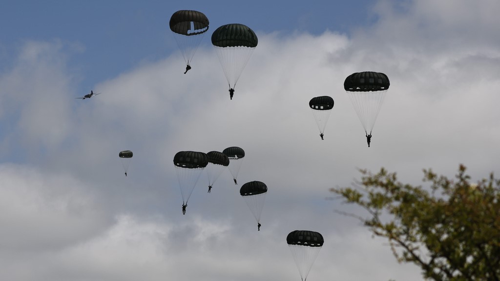 Parachute drop in Carentan-Les-Marais in Normandy, France on Sunday, June 02, 2024, ahead of D-Day 80th anniversary commemorations. (AP Photo/Jeremias Gonzalez)