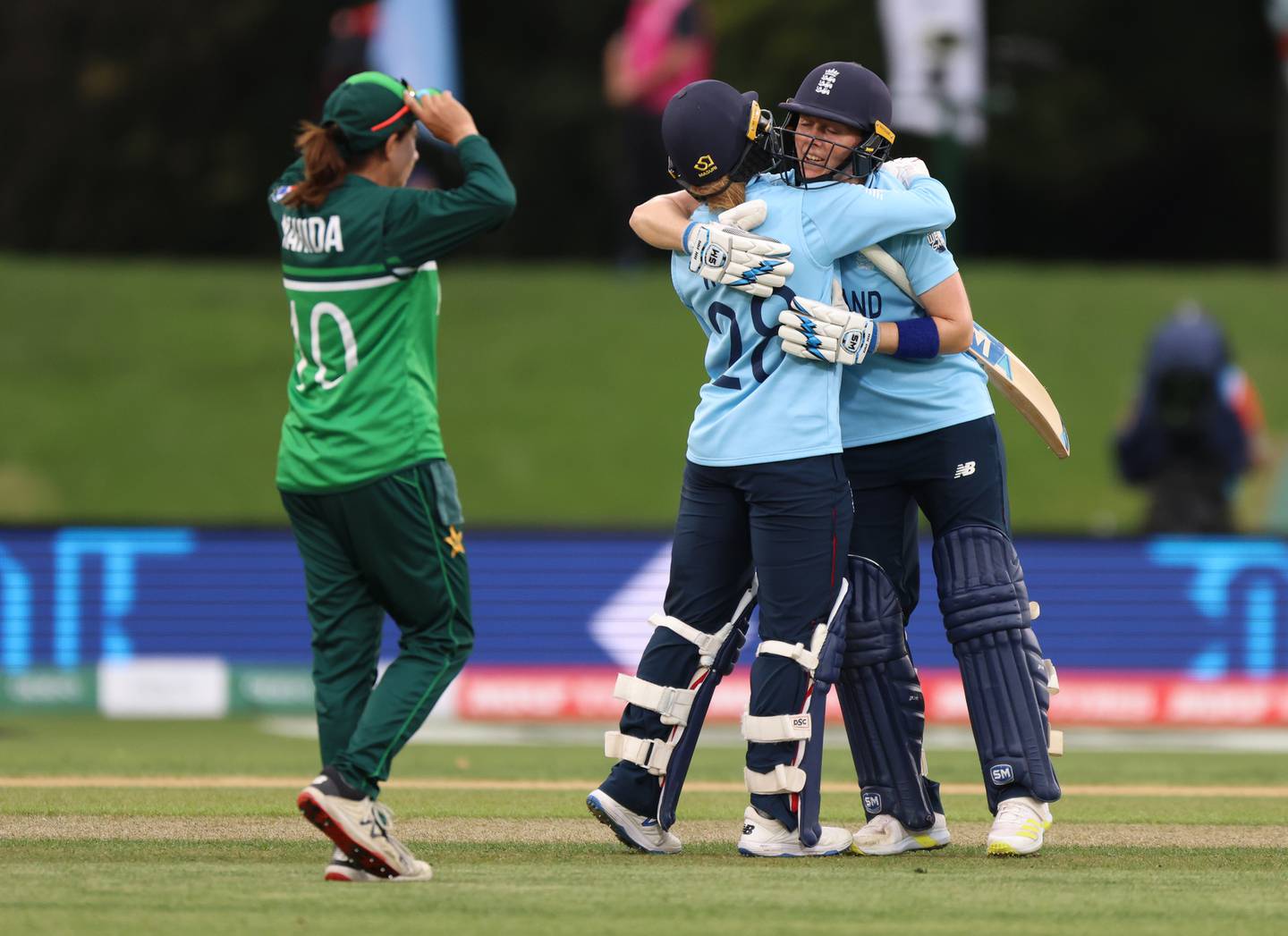 Danni Wyatt and Heather Knight embrace after closing out the game to beat Pakistan. (Photo / Getty)