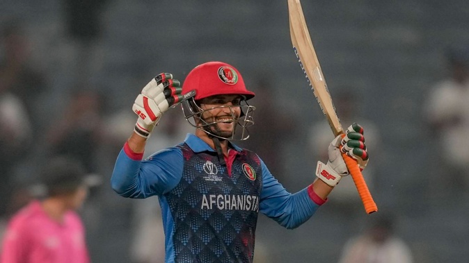 Afghanistan's Azmatullah Omarzai celebrates after hitting the winning runs to beat Sri Lanka. Photo / AP