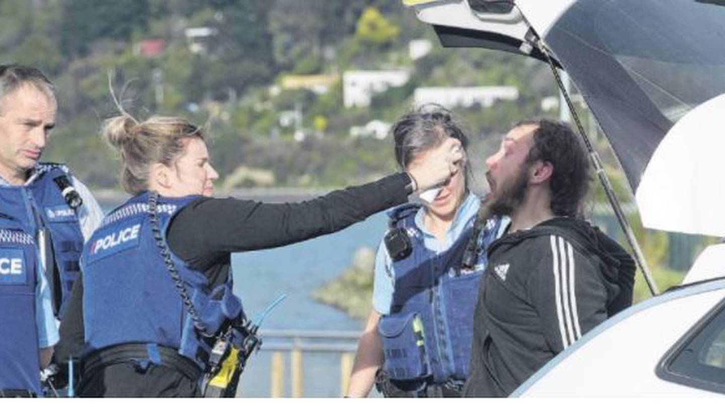 Police helped wash the pepper-spray off Justin Witchall's face after arresting him followinga lengthy chase. (Photo / Otago Daily Times)