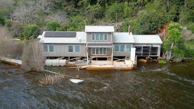 The level of Lake Rotoehu has risen to a point where lakeside homes, including the Blairs', are being flooded. Photo / Andrew Warner