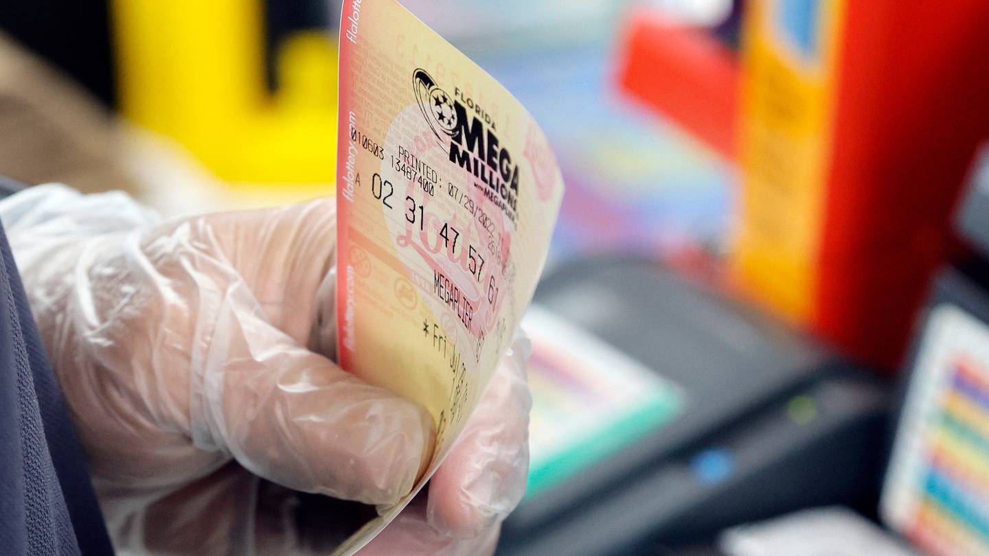 Andres Fernandez sells Mega Millions lottery tickets at a Chevron station in Oakland Park, Florida, on Friday, July 29. It was not the prize winning ticket. Photo / AP