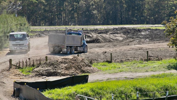 Truckloads of silt being dumped at a Hawke's Bay silt deposit site. Photo / Warren Buckland