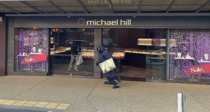 The pair fled to a waiting car. Photo / Supplied