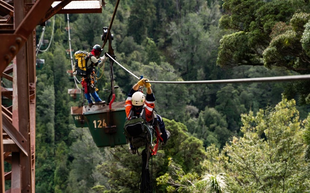 Protesters 80m high claim 'hostile' tactics used in coal mine standoff