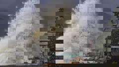 Big swell hits the back yards of Te Awanga beach houses, Napier. Photo / Warren Buckland