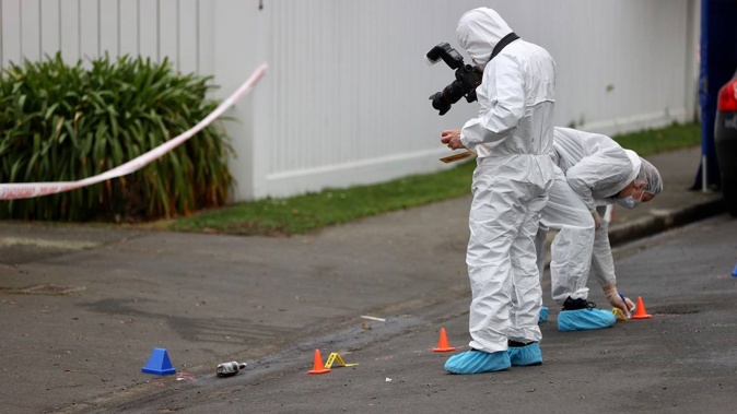 A Police forensic team at work at the property in Medbury Tce, Fendalton on Saturday. (Photo / George Heard)