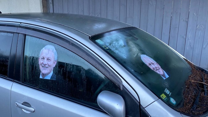 A picture of Auckland mayor Phil Goff adorns an abandoned car in central Auckland. (Photo / Jake Morrison)