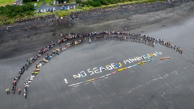 Hapū and iwi continue to lead the decade-long fight against the proposed South Taranaki seabed mine. Community-wide events this year attracted hundreds to spell out their opposition. Photo / Tania Niwa