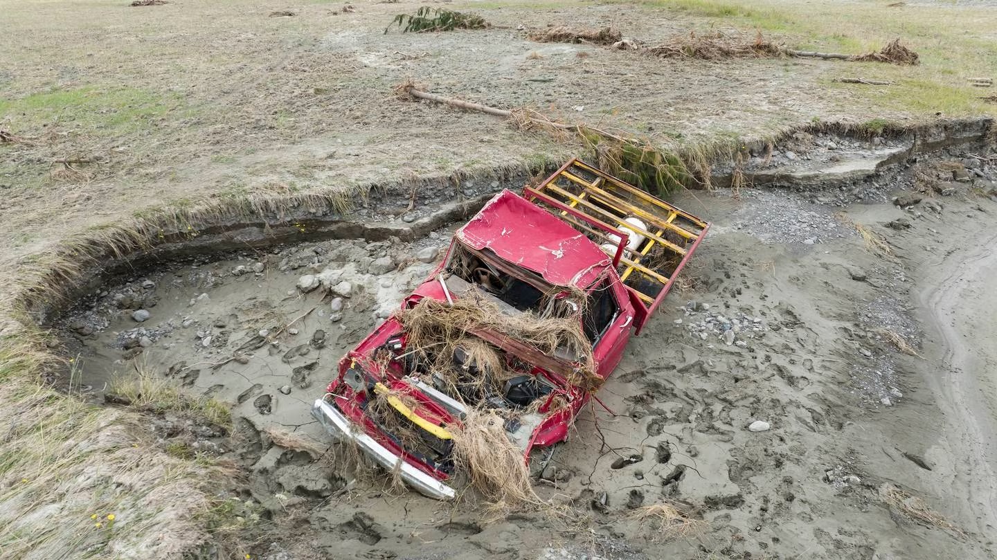 Brendan Miller’s truck after it was swept off the Omapere bridge and was washed away in flood waters. Photo / George Heard