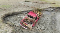 Brendan Miller’s truck after it was swept off the Omapere bridge and was washed away in flood waters. Photo / George Heard