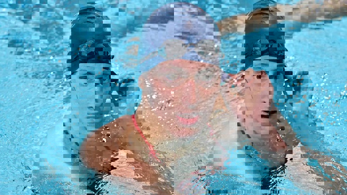 Transgender swimmer Lia Thomas speaks to her coach after winning the 500 metre freestyle for Pennsylvania during a meet with Harvard. Photo / AP