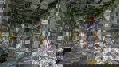 Josh Adam and his father Justin Adam look through the remains of their sleepout that burnt down with two kittens and a cat inside on Wednesday morning, in Raureka, Hastings. Photo / Warren Buckland