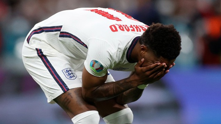 England's Marcus Rashford reacts after failing to score a penalty during a shootout at the end of the Euro 2020 soccer championship final match between England and Italy. (Photo / AP)