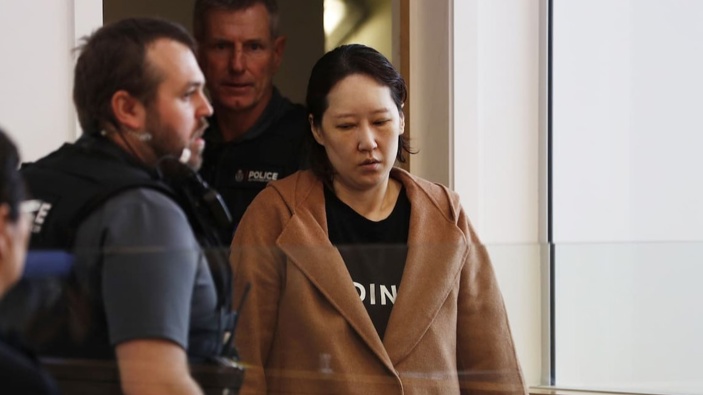 Hakyung Lee, accused of murdering her two children and leaving their bodies in an Auckland storage unit as she moved overseas, appears in Manukau District Court in November 2022 shortly after she was extradited from South Korea. Photo / Dean Purcell
