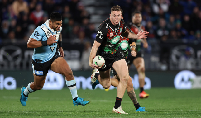 Rocco Berry carries the ball against the Sharks. Photo / Photosport