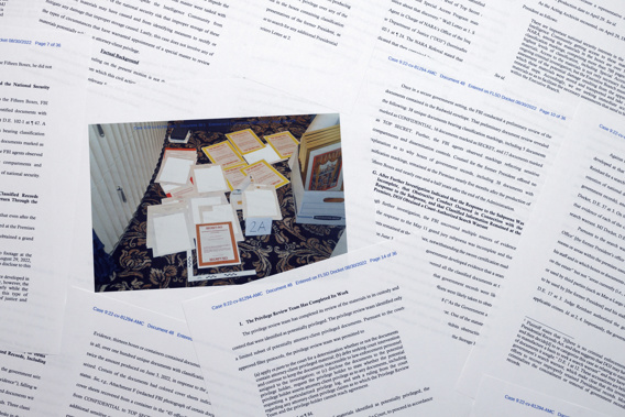 Pages from a Department of Justice court filing on Aug. 30, 2022, in response to a request from the legal team of former President Donald Trump for a special master to review the documents seized during the Aug. 8 search of Mar-a-Lago, are photographed early Aug. 31, 2022. Included in the filing was an FBI photo of documents that were seized during the search. Photo / AP
