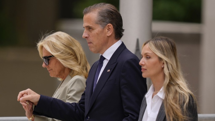 Hunter Biden, center, President Joe Biden's son, accompanied by his mother, first lady Jill Biden, left, and his wife, Melissa Cohen Biden, right, walking out of federal court after hearing the verdict, Tuesday, June 11, 2024, in Wilmington, Del. (AP Photo/Matt Rourke)