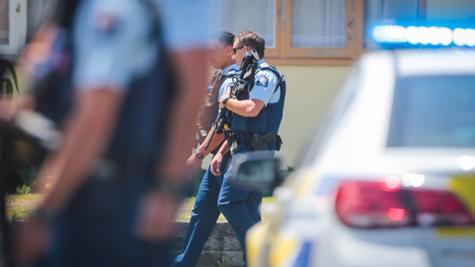Police in a suburban Napier street on Saturday after an incident in which a man suffered a wound from a firearm. Photo / NZME