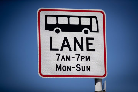 One of the new signs that have been installed on Karangahape Rd extending bus lane hours from 7am to 7pm. Photo / Dean Purcell