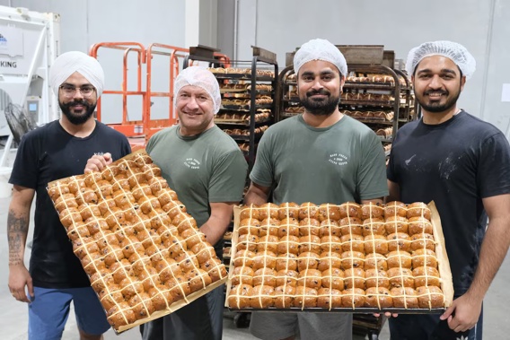 Volare bread department manager Dion Mackwood (second-left) said the Silver Award for the bakery's hot cross buns recognised a 'massive amount' of teamwork. Photo / Maryana Garcia
