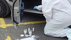 A forensic scientist from the ESR retrieves a DNA sample from a stolen car. Ricky Tukurangi twice left blood on cars he tried to break into. Photo / File