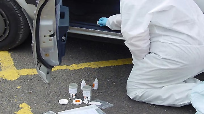 A forensic scientist from the ESR retrieves a DNA sample from a stolen car. Ricky Tukurangi twice left blood on cars he tried to break into. Photo / File