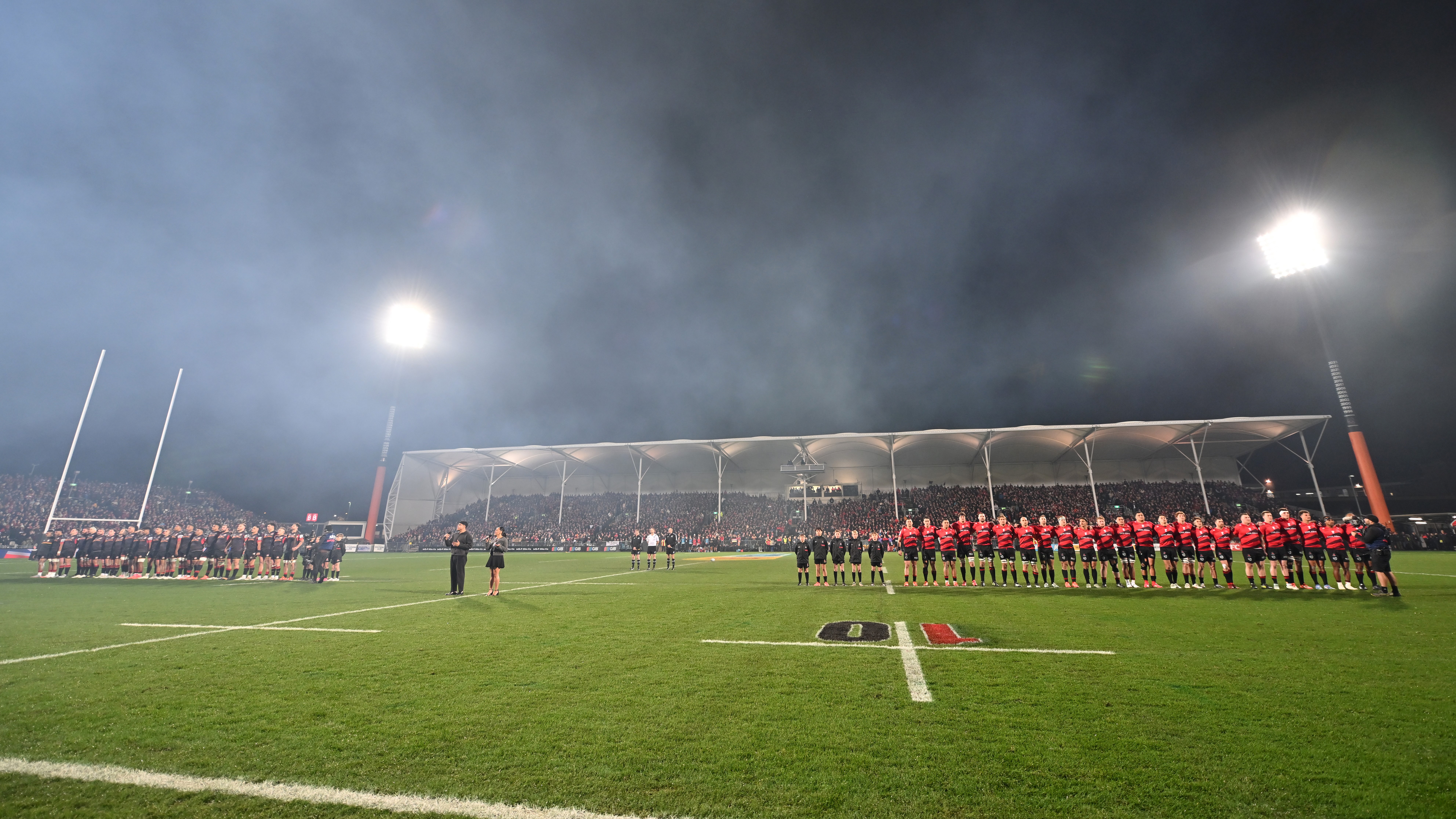 Teams line up for the national anthem ahead of the Super Rugby Pacific Grand Final match between Crusaders and Chiefs at Apollo Projects Stadium on June 21, 2025 in Christchurch, New Zealand. (Photo by Kai Schwoerer/Getty Images)