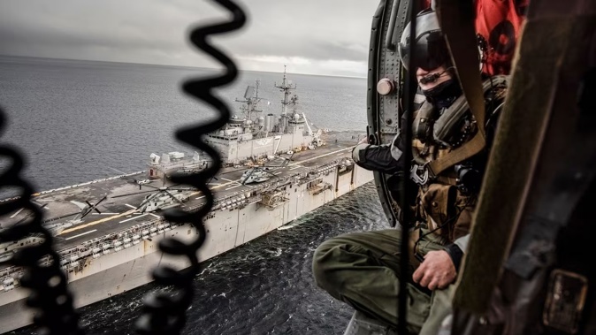 The US amphibious assault ship Iwo Jima from is seen from an SH-60 helicopter during Nato exercises in the sea off Norway in 2018. It is part of a group of warships being sent to Caribbean and Pacific waters. Photo / Laetitia Vancon, The New York Times