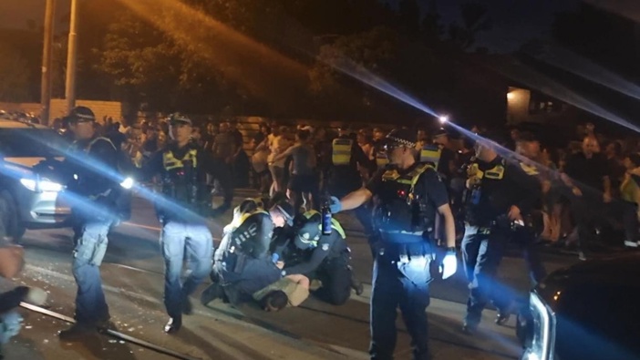 Pro-Palestinian protesters were pepper sprayed in a chaotic clash with police after rallying in Caulfield. (Photo / news.com.au)